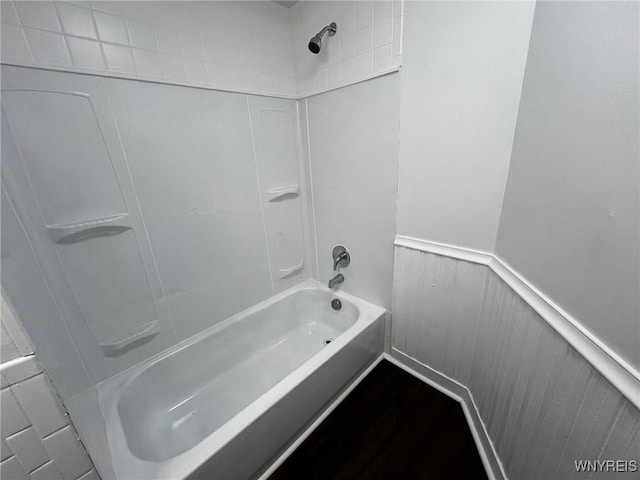 228 Weiss St, Buffalo, NY 14206 - bathroom featuring shower / tub combination, wainscoting, and wood finished floors