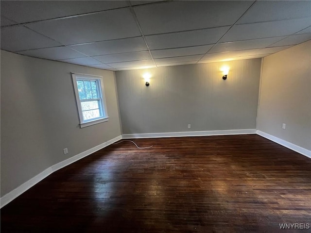 228 Weiss St, Buffalo, NY 14206 - unfurnished room featuring wood finished floors, baseboards, and a paneled ceiling