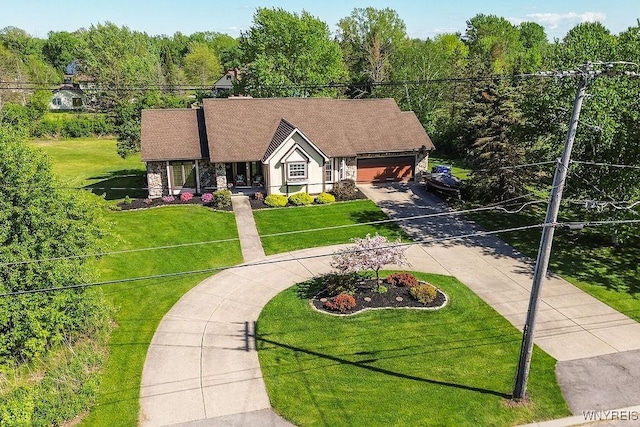 4590 Beach Ridge Rd, Pendleton, NY 14094 - view of front of home with concrete driveway, an attached garage, a front lawn, and stone siding