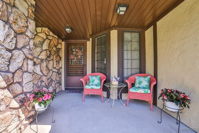 4590 Beach Ridge Rd, Pendleton, NY 14094 - doorway to property with stone siding, covered porch, and stucco siding