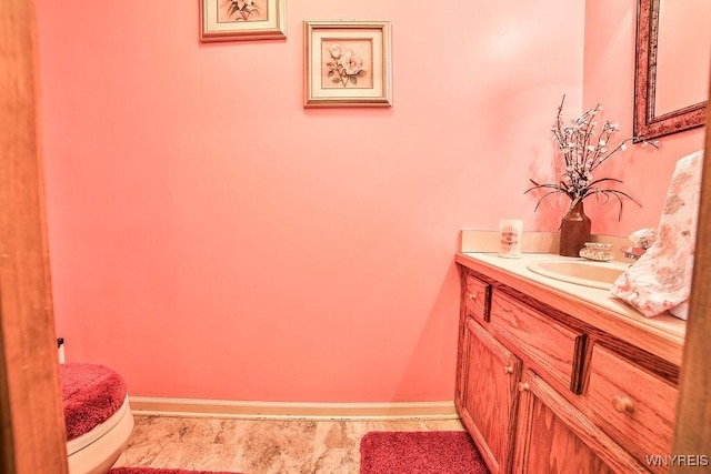 4590 Beach Ridge Rd, Pendleton, NY 14094 - half bathroom featuring toilet, vanity, and baseboards
