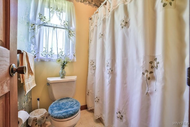 4590 Beach Ridge Rd, Pendleton, NY 14094 - bathroom with toilet, a shower with curtain, and tile patterned floors