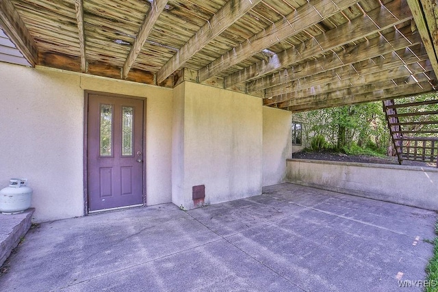 4590 Beach Ridge Rd, Pendleton, NY 14094 - property entrance featuring stucco siding and a patio