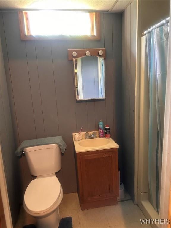 4590 Beach Ridge Rd, Pendleton, NY 14094 - bathroom featuring vanity, tile patterned flooring, a shower with shower curtain, and a decorative wall