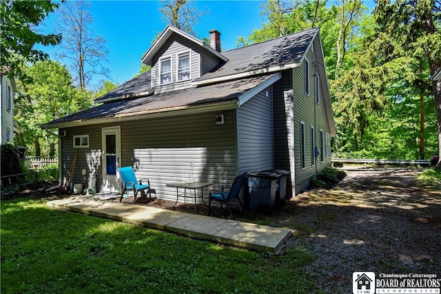 8 Terrace St, Westfield, NY 14787 - back of property with a chimney and roof with shingles