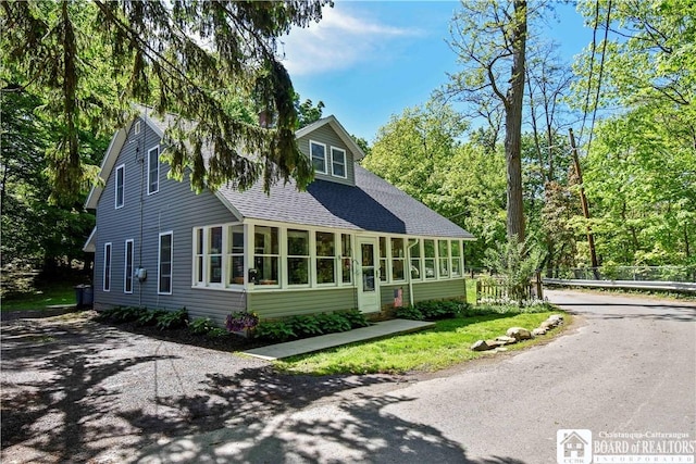 8 Terrace St, Westfield, NY 14787 - view of front facade with a shingled roof and a sunroom