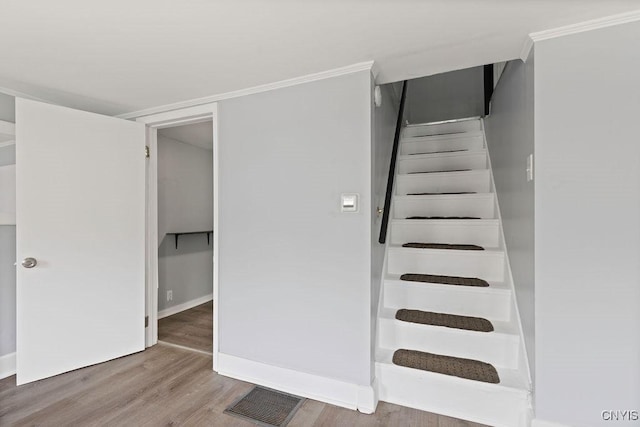 210 Essex St, Syracuse, NY 13204 - staircase with wood finished floors and baseboards