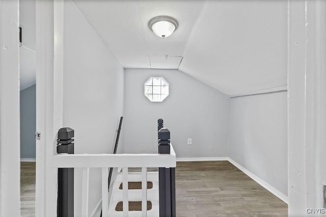 210 Essex St, Syracuse, NY 13204 - bonus room featuring vaulted ceiling, wood finished floors, and baseboards