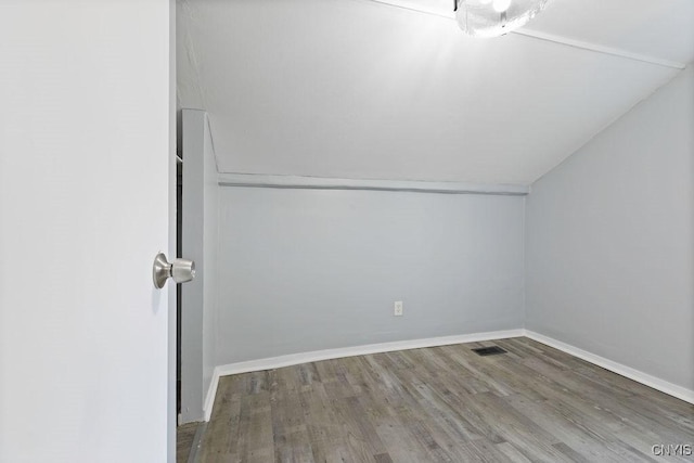 210 Essex St, Syracuse, NY 13204 - additional living space with vaulted ceiling, wood finished floors, and baseboards