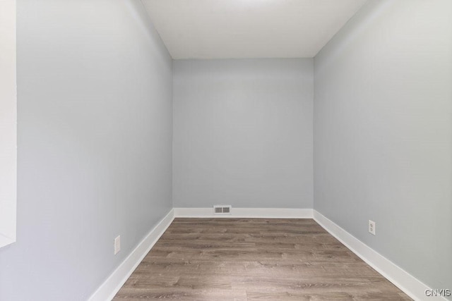 210 Essex St, Syracuse, NY 13204 - spare room with wood finished floors and baseboards