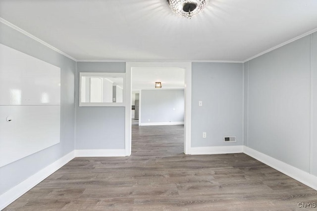210 Essex St, Syracuse, NY 13204 - unfurnished room with wood finished floors, crown molding, and baseboards