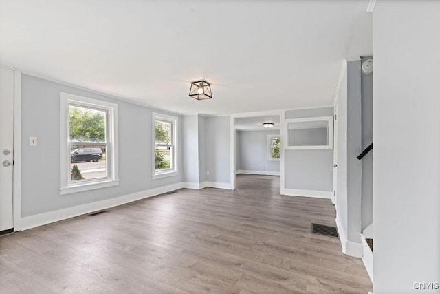 210 Essex St, Syracuse, NY 13204 - unfurnished dining area featuring wood finished floors and baseboards