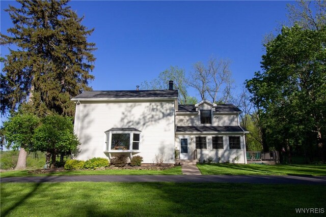 4748 Thrall Rd, Cambria, NY 14094 - back of house with a lawn