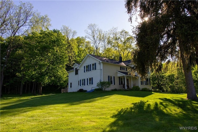 4748 Thrall Rd, Cambria, NY 14094 - view of front of house featuring a front lawn and a chimney