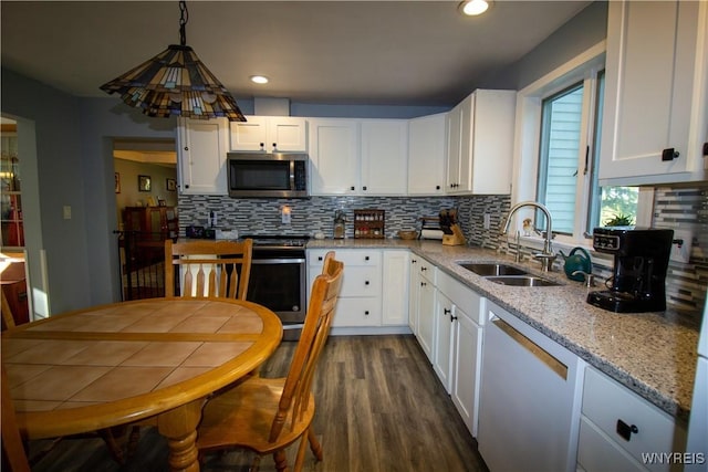 4748 Thrall Rd, Cambria, NY 14094 - kitchen with stainless steel appliances, a sink, decorative backsplash, white cabinets, and recessed lighting