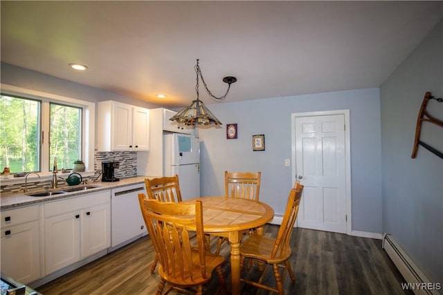4748 Thrall Rd, Cambria, NY 14094 - dining space featuring a baseboard heating unit, dark wood-type flooring, and recessed lighting
