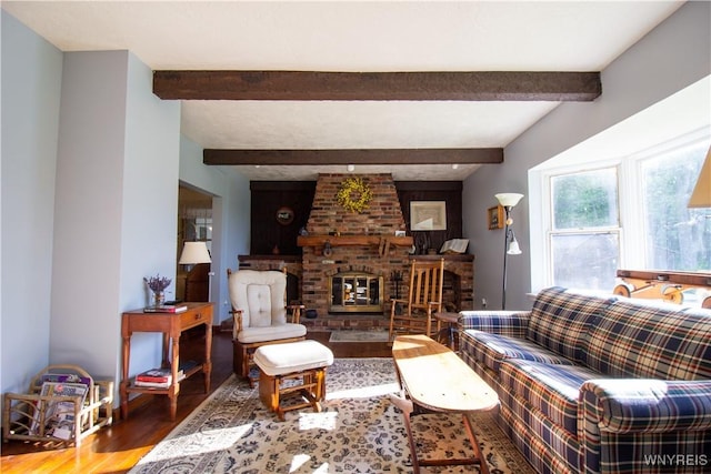 4748 Thrall Rd, Cambria, NY 14094 - living area featuring wood finished floors, a brick fireplace, and beam ceiling