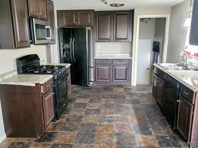 146 Lou Ann Dr, Cheektowaga, NY 14043 - kitchen with black appliances, dark brown cabinetry, light countertops, and dark stone finish flooring