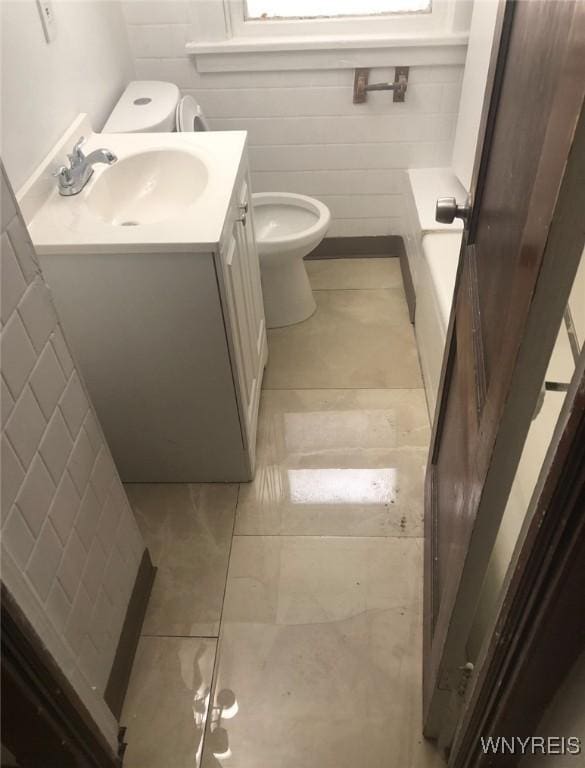 11 Verdun Ave, Buffalo, NY 14214 - full bath with toilet, vanity, and a tub to relax in