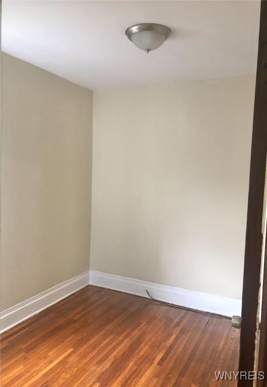 11 Verdun Ave, Buffalo, NY 14214 - unfurnished room featuring baseboards and wood finished floors