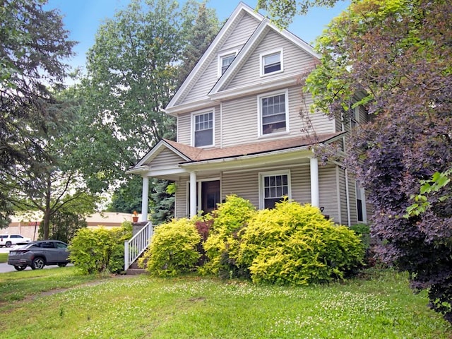 1459 Culver Rd, Rochester, NY 14609 - traditional style home with a porch and a front lawn
