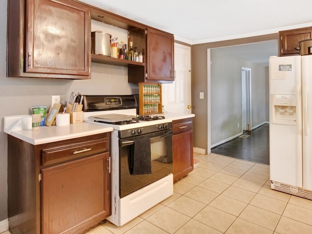 1459 Culver Rd, Rochester, NY 14609 - kitchen featuring white appliances, light tile patterned flooring, light countertops, and open shelves