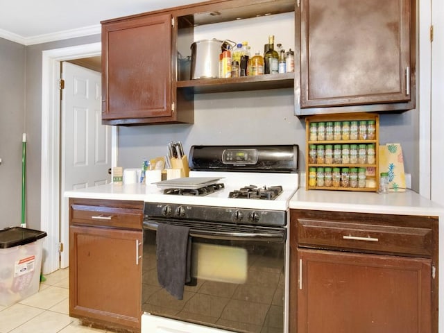 1459 Culver Rd, Rochester, NY 14609 - kitchen with white range with gas stovetop, ornamental molding, light countertops, light tile patterned floors, and open shelves