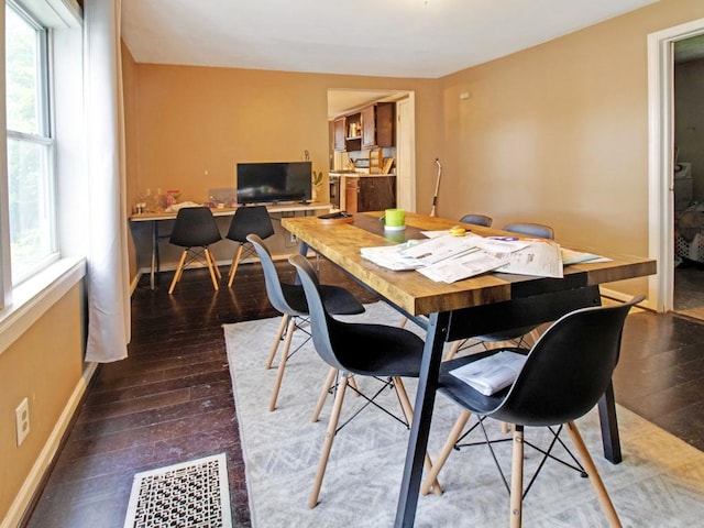 1459 Culver Rd, Rochester, NY 14609 - dining space with healthy amount of natural light, wood-type flooring, and a desk