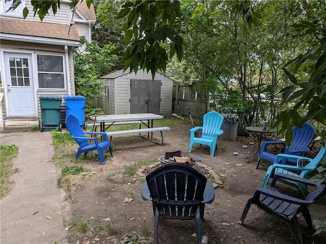 1459 Culver Rd, Rochester, NY 14609 - view of yard with an outdoor fire pit, a shed, outdoor dining space, and a patio area