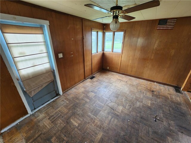 98 Gardeau St, Perry, NY 14530 - unfurnished room with ceiling fan, wood walls, and baseboards