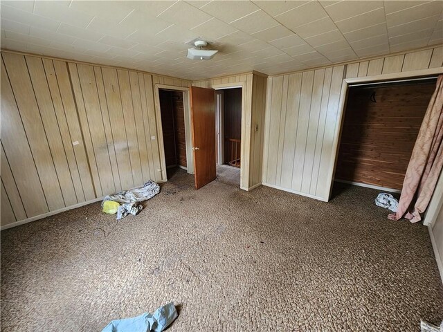 98 Gardeau St, Perry, NY 14530 - unfurnished bedroom with wooden walls and carpet