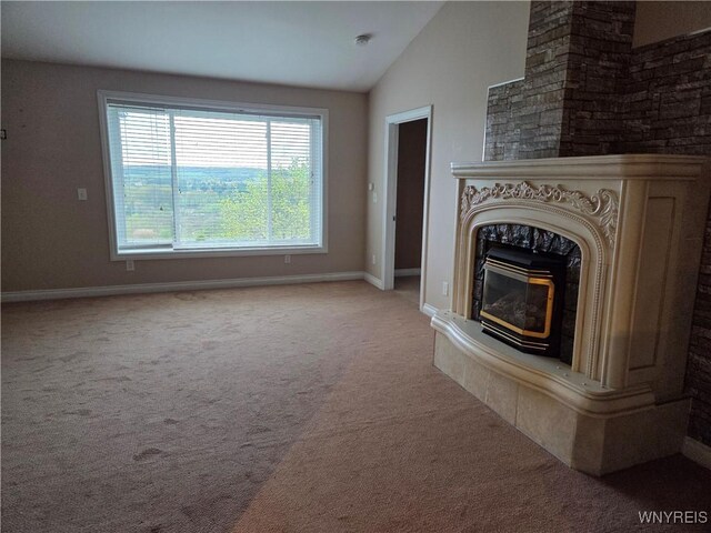 9600 Vermont View Rd, Machias, NY 14101 - unfurnished living room with carpet floors, vaulted ceiling, baseboards, and a wood stove