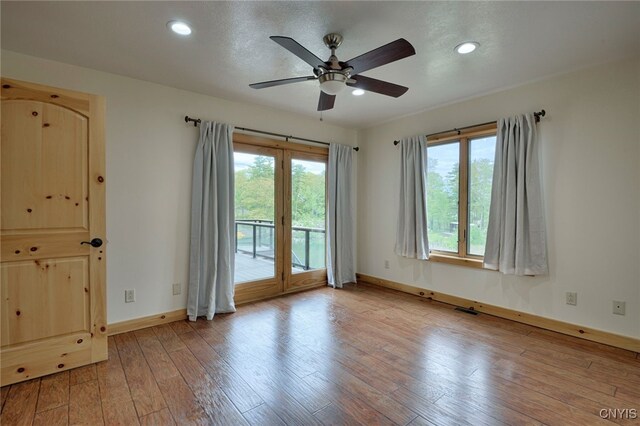 20172 Blue Heron Ln, Alexandria, NY 13607 - unfurnished room with a ceiling fan, baseboards, wood-type flooring, and recessed lighting