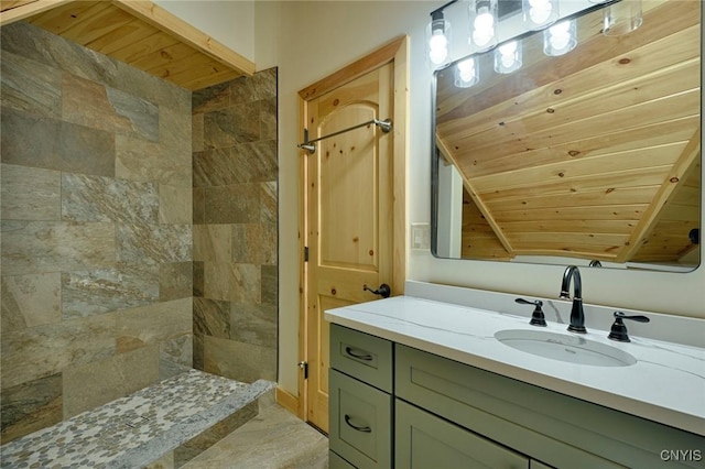 20172 Blue Heron Ln, Alexandria, NY 13607 - bathroom featuring wood ceiling, vanity, and a tile shower