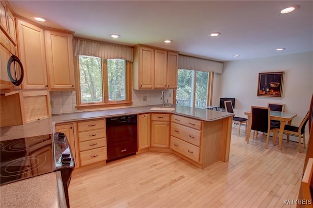7 Forsythia Ct, Orchard Park, NY 14127 - kitchen with black dishwasher, light brown cabinets, a sink, and recessed lighting