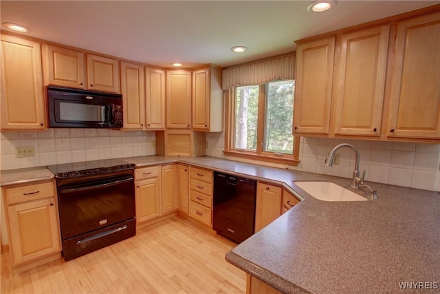 7 Forsythia Ct, Orchard Park, NY 14127 - kitchen featuring black appliances, a sink, light brown cabinetry, tasteful backsplash, and recessed lighting