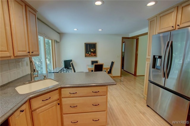 7 Forsythia Ct, Orchard Park, NY 14127 - kitchen with stainless steel fridge with ice dispenser, a sink, a peninsula, light brown cabinets, and recessed lighting