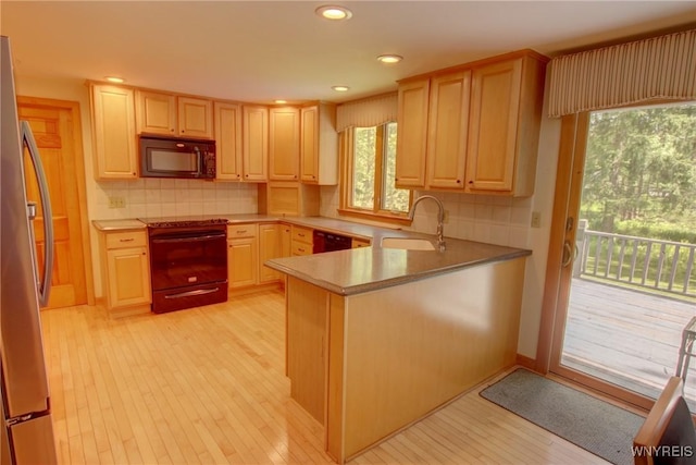 7 Forsythia Ct, Orchard Park, NY 14127 - kitchen featuring black appliances, a sink, light brown cabinets, and recessed lighting