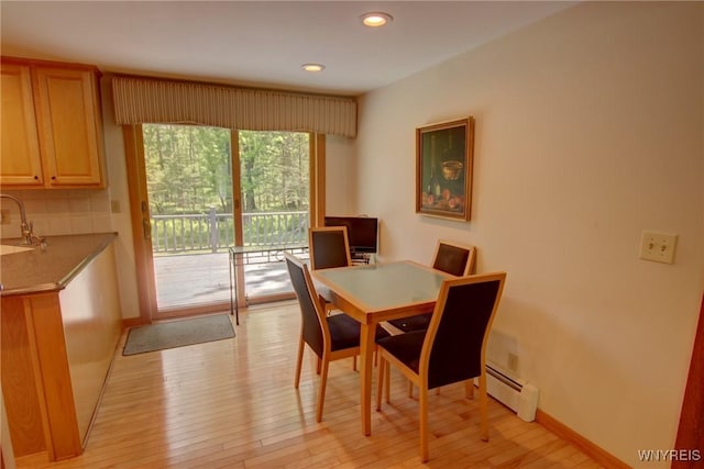 7 Forsythia Ct, Orchard Park, NY 14127 - dining area featuring baseboard heating, light wood finished floors, recessed lighting, and baseboards