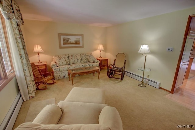 7 Forsythia Ct, Orchard Park, NY 14127 - living area with a baseboard radiator, carpet flooring, and baseboards