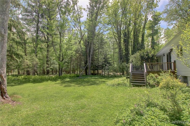 7 Forsythia Ct, Orchard Park, NY 14127 - view of grassy yard featuring stairway and a deck