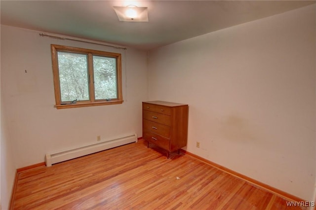 7 Forsythia Ct, Orchard Park, NY 14127 - unfurnished room featuring baseboard heating, light wood-type flooring, and baseboards