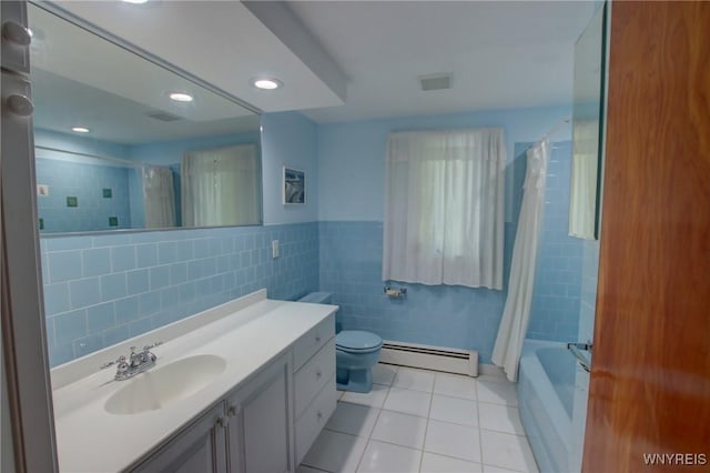 7 Forsythia Ct, Orchard Park, NY 14127 - full bathroom featuring a baseboard heating unit, tile walls, tile patterned flooring, vanity, and toilet
