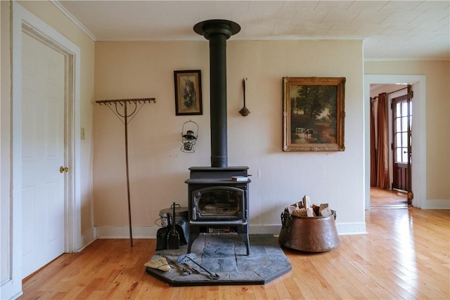 2400 Gladstone Hollow Rd, Andes, NY 13731 - detailed view of a wood stove, wood finished floors, ornamental molding, and baseboards