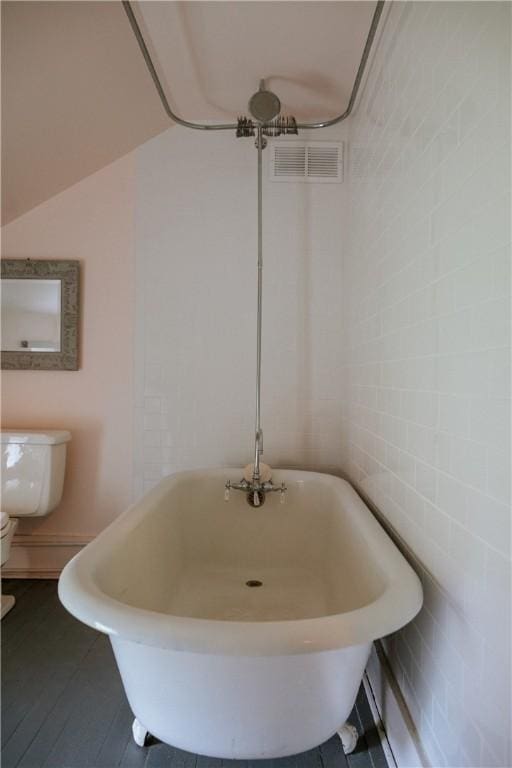 2400 Gladstone Hollow Rd, Andes, NY 13731 - bathroom featuring a freestanding bath, toilet, and baseboard heating