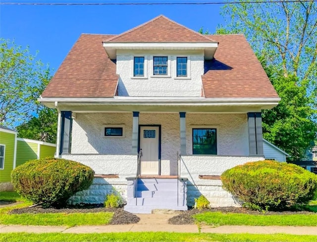 561 Post St, Elmira-City, NY 14904 - view of front of property featuring a porch, stucco siding, and a shingled roof