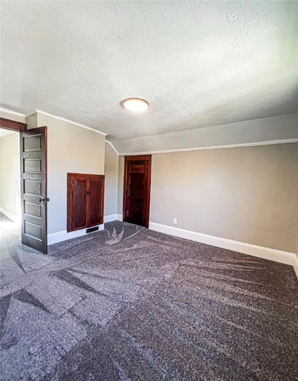 561 Post St, Elmira-City, NY 14904 - carpeted spare room featuring a textured ceiling and baseboards