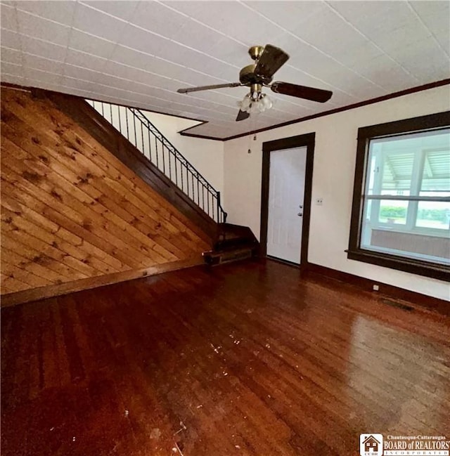 423 Plover St, Dunkirk-City, NY 14048 - unfurnished living room with wood finished floors, baseboards, stairs, and a ceiling fan