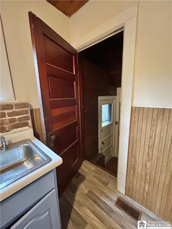 423 Plover St, Dunkirk-City, NY 14048 - bathroom featuring vanity and wood finished floors