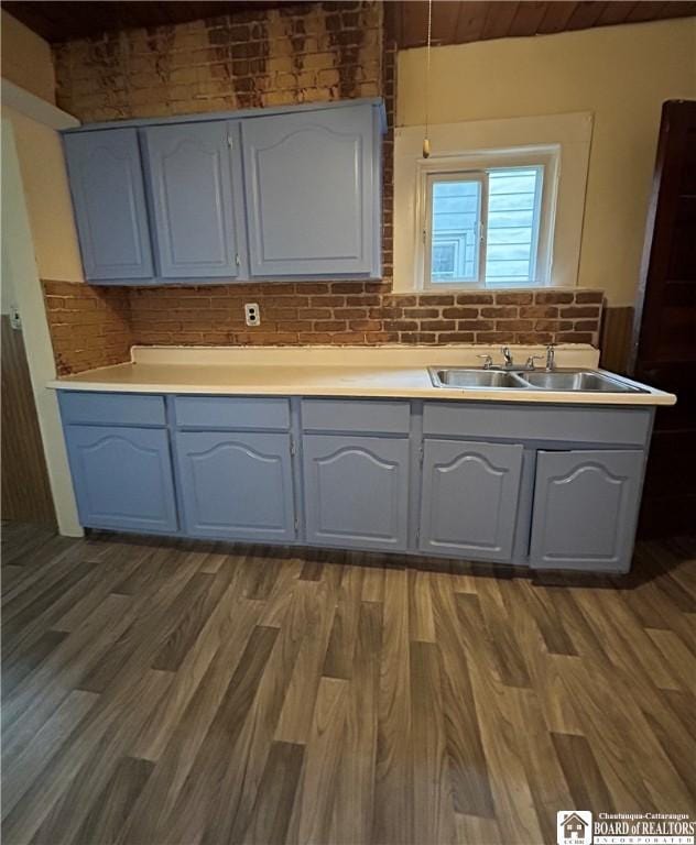 423 Plover St, Dunkirk-City, NY 14048 - kitchen with a sink, wood finished floors, light countertops, and gray cabinets